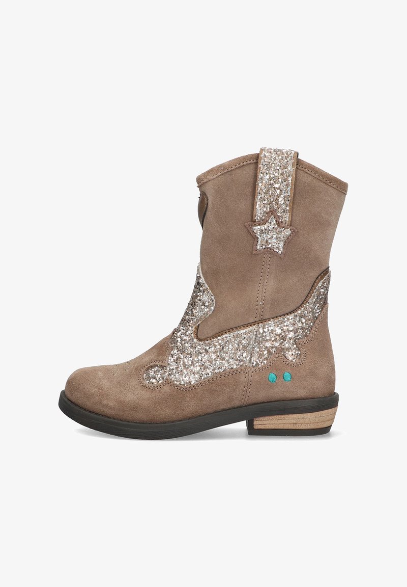 Tan suede boot with glittering silver star and accent patches. Features blue circular detail, stacked heel, and classic western silhouette.