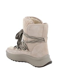 Stivale alla caviglia in suede beige con un pannello in shearling testurizzato, caratterizzato da lacci verde oliva, una suola imbottita e una punta rotonda.