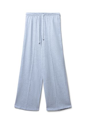 Pantalons larges gris clair en tissu doux, dotés d'une taille élastique avec cordon de serrage et de coutures latérales pour un détail supplémentaire.