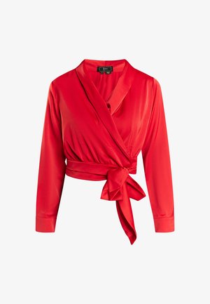Bluză roșie dintr-un material neted, cu mâneci lungi, decolteu adânc în V și detaliu cu talie legată pentru o siluetă accentuată.