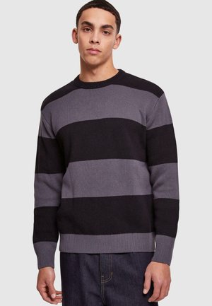 Gray and black striped sweater with a crew neckline and ribbed cuffs. Made of textured knit fabric, featuring wide horizontal stripes.