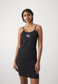 Calvin Klein Jeans MONOLOGO STRAPPY DRESS - Jersey dress - black ...