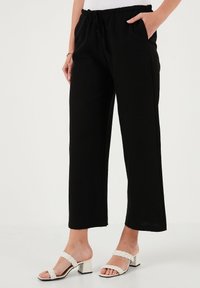 LELA REGULAR FIT - Hlače - black