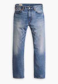 Herrblå denimjeans med bleknade detaljer, femficksdesign och knappstängning vid midjan.