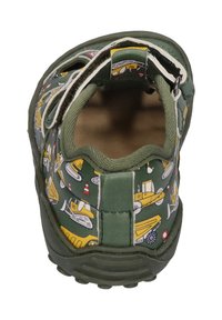 Green children's shoe with a patterned upper featuring construction vehicles, elastic closure, and a textured rubber sole.