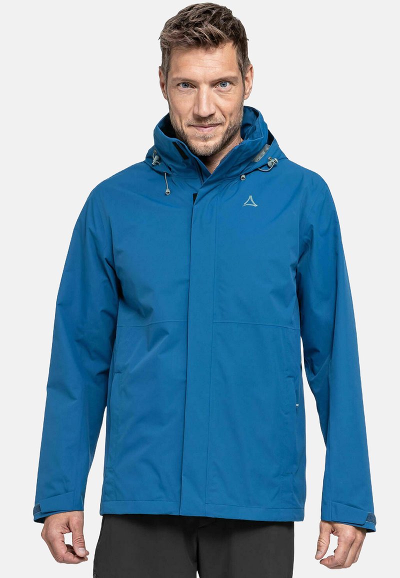 Giacca impermeabile blu con cappuccio, realizzata in tessuto liscio. Presenta una chiusura a zip frontale, cordini regolabili e due tasche laterali.