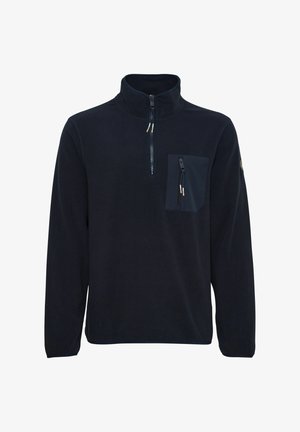 Mornarsko polarno pulover s high collar, pol-zadrgo in žepom na prsih z zadrgo. Gladka tekstura, sproščen kroj.