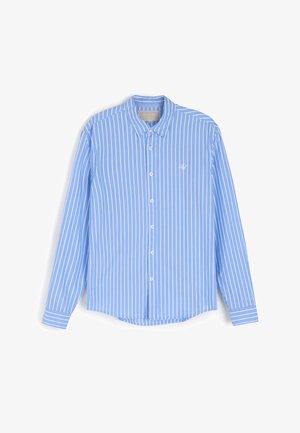 Jasnoniebieska, długorękawowa, koszula z kołnierzykiem w pionowe białe paski. Posiada guziki na przodzie i małe logo na piersi. Miękka tkanina.