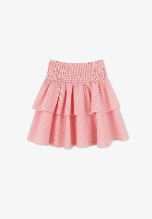 Jupe à volants rayée rouge et blanche avec taille élastique. Comprend trois couches froncées et un tissu léger pour plus de confort.