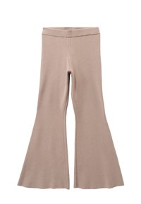 Beige flared leggings van zacht gebreid materiaal. Heeft een aansluitende taille en een brede flare aan de onderkant. Gladde textuur met minimale stiksels.