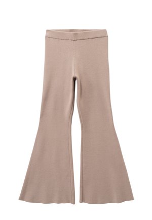 Leggings évasés beige en tissu tricot doux. Dotés d'une taille ajustée et d'un large évasement à l'ourlet. Texture lisse avec des détails de couture minimaux.