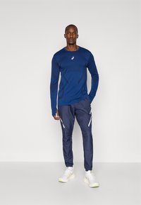 ASICS LITE-SHOW PANT - Outdoor trousers - midnight