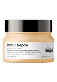 Hair mask in a round jar; cream-colored body with a glossy black lid. Label includes product name, description, and volume details.