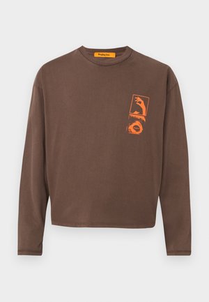 Brown long-sleeve t-shirt with a rectangular orange graphic design on the left chest, featuring hand and wave motifs. Made of soft cotton material.