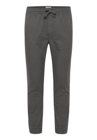 Grijze broek met elastische taille en trekkoord, taps toelopende pijpen en boorden bij de enkels. Gemaakt van een lichtgewicht, gladde stof.