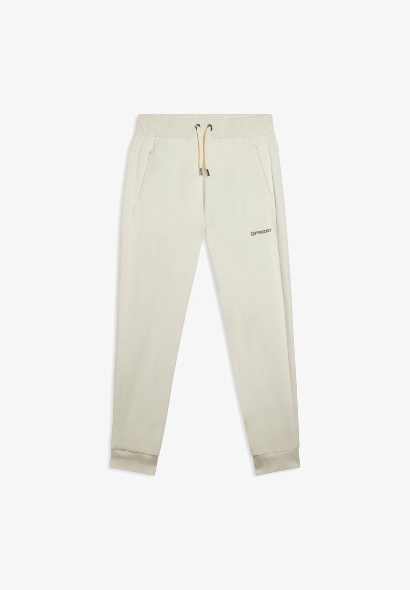 Joggers de color beige claro, hechos de una tela suave, que cuentan con una cintura elástica con cordones, bolsillos laterales y puños en los tobillos.