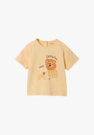 Hellorange Baby-T-Shirt mit Illustrationen eines brüllenden Löwen und seines Jungtiers sowie dem Text "Grrra Ouu" und "mini" auf der Vorderseite.