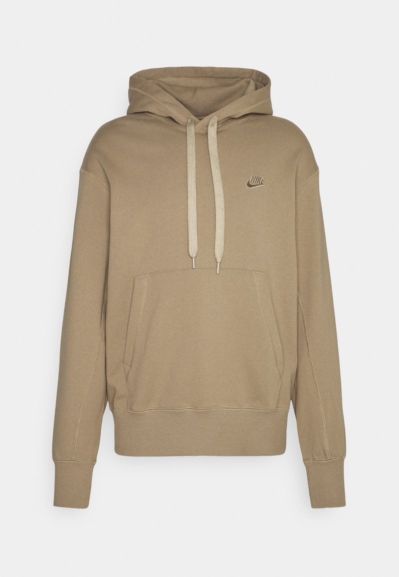 Sudadera con capucha beige de Nike con bolsillo tipo canguro en la parte delantera, cordones beige, puños acanalados y pequeño logo de Nike bordado en el pecho.