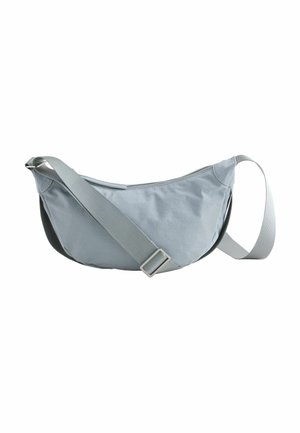 Light gray crescent-shaped crossbody bag with adjustable strap and top zipper closure, isolated on white background.