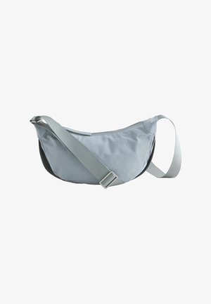 Light gray crescent-shaped crossbody bag with adjustable strap and top zipper closure, isolated on white background.
