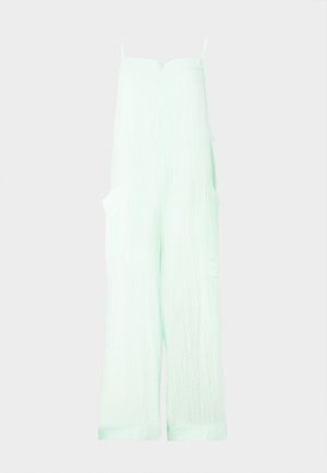 Hellgrüner Jumpsuit aus weichem, strukturiertem Stoff mit verstellbaren Spaghettiträgern, weitem Bein und zwei seitlichen Taschen.