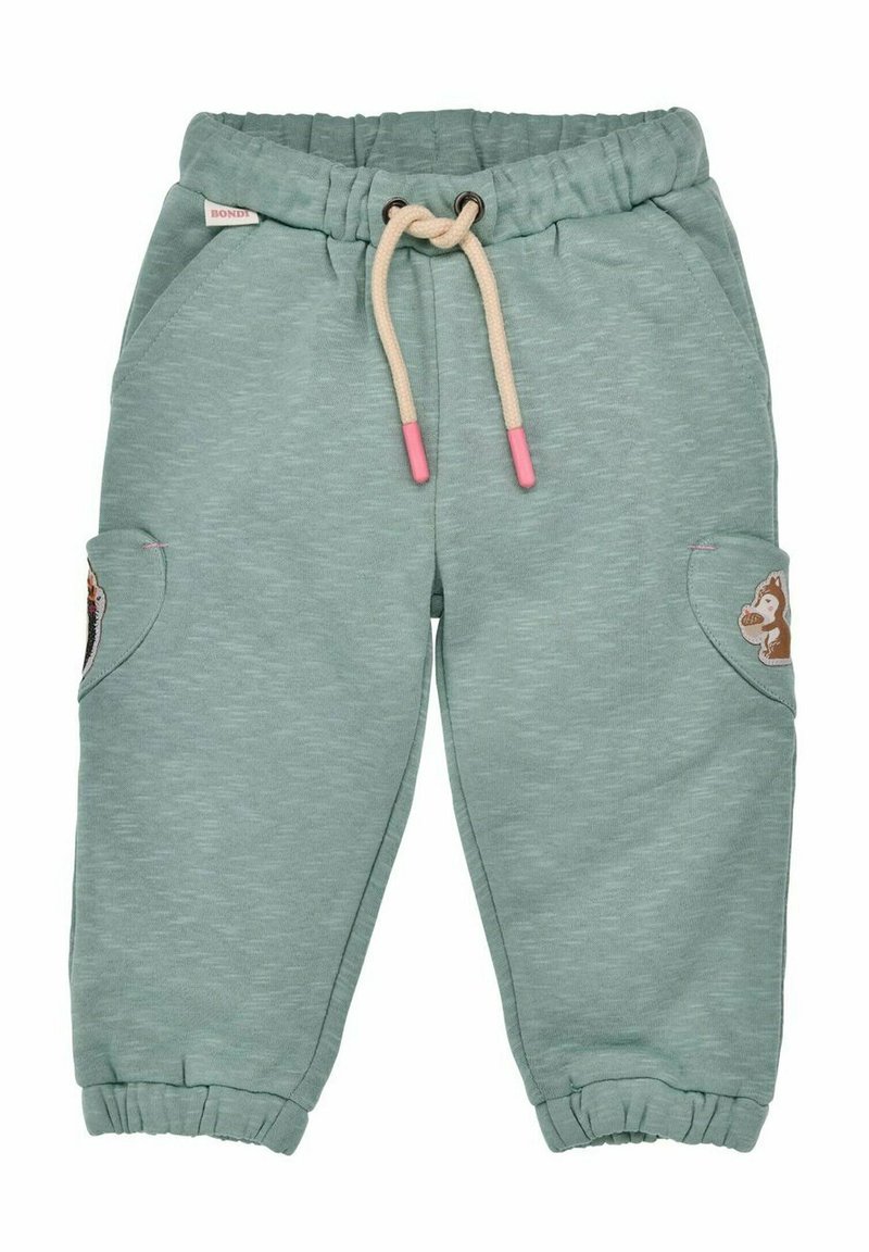 Pantaloni della felpa verde chiaro con cintura regolabile, polsini alle caviglie e tasche laterali con un dettaglio a toppa di scoiattolo. Tessuto morbido.
