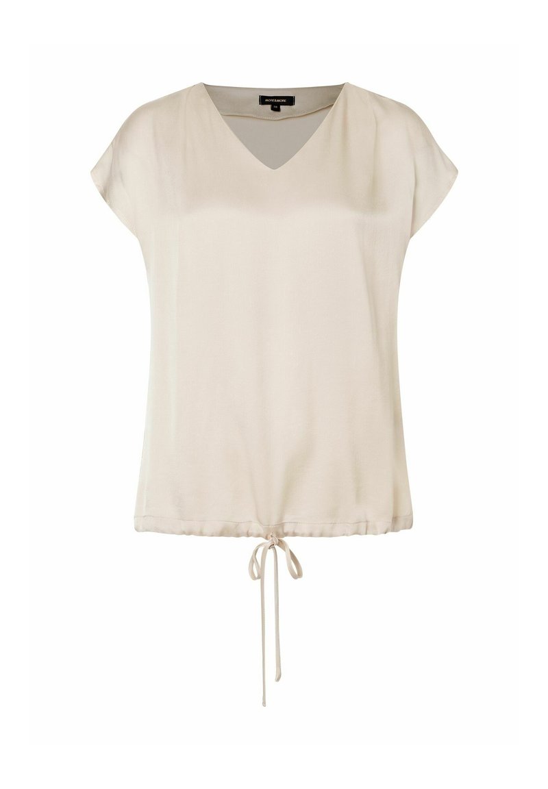 Top beige a V con maniche corte, orlo arricciato con coulisse. Realizzato in un tessuto leggero e liscio con una vestibilità rilassata.