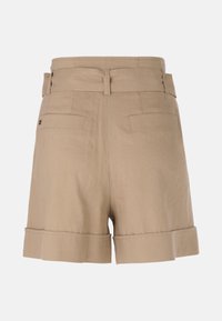 Beige linen shorts with a high waist, rolled cuffs, and two back pockets. Smooth texture with a clean, tailored design.
