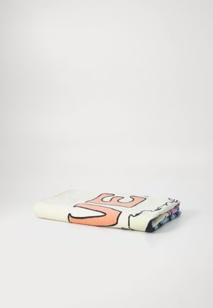 Colorful cotton towel with bold orange lettering and graphic designs. Soft texture; edges feature various patterned accents in blue and purple.
