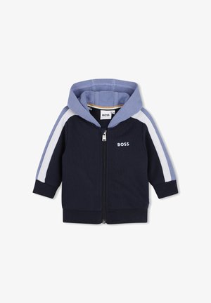 Sweat à capuche zippé bleu marine avec panneaux contrastants bleu clair aux épaules et aux manches. Il comporte une fermeture éclair à l'avant et un logo "BOSS" sur la poitrine.