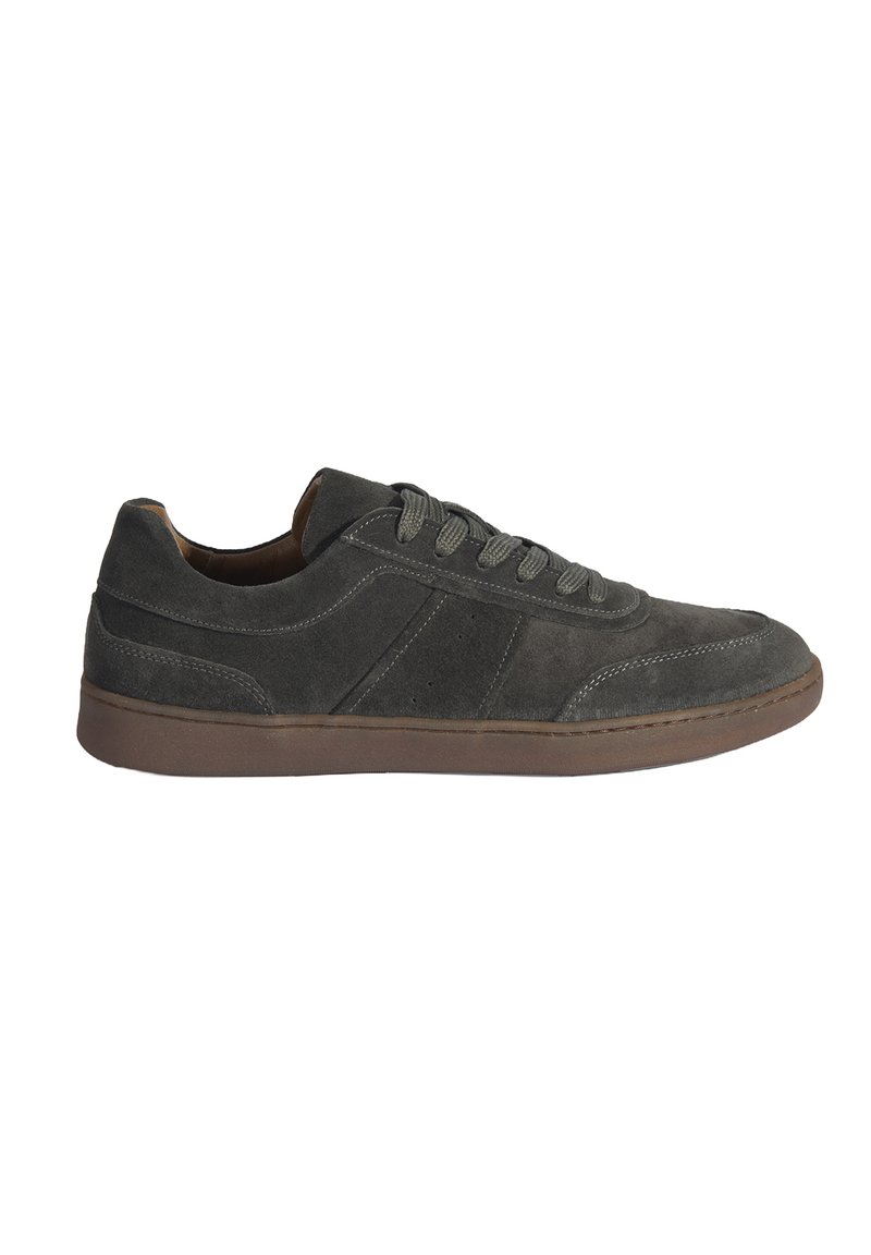 Gray suede sneakers with a low profile, round toe, and contrasting brown rubber sole. Features tonal laces and stitched detailing on the upper.