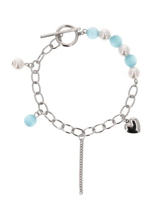 Silver chain bracelet with alternating light blue and white beads, toggle clasp, heart charm, and a dangling chain extension.