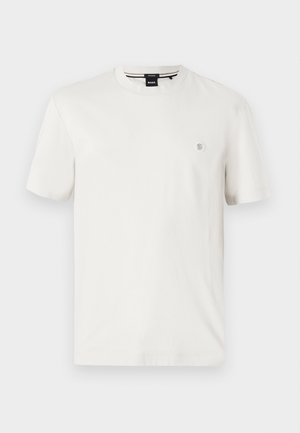White cotton t-shirt with a round neckline, short sleeves, and a small logo patch on the left chest. Smooth texture, regular fit.
