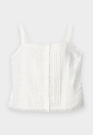 Camisole blanche sans manches à boutons, avec plis sur le devant et bordure en dentelle à l’ourlet sur fond uni.
