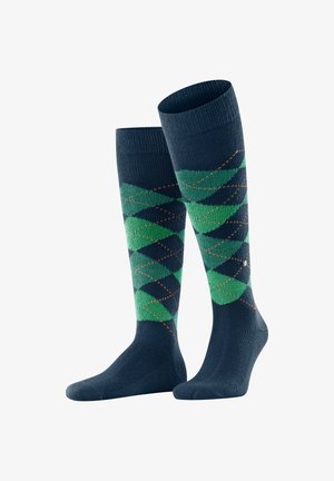 Kniestrümpfe aus marineblauem Stoff mit grünen und schwarzen Rautenmuster und orangefarbenen Akzenten im Design. Weicher Stoff.