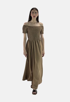 Brun maxikjole med off-the-shoulder design, smocked bærestykke og blød nederdel. Lavet af letvægtsstof, har korte puffærmer og en afslappet pasform.
