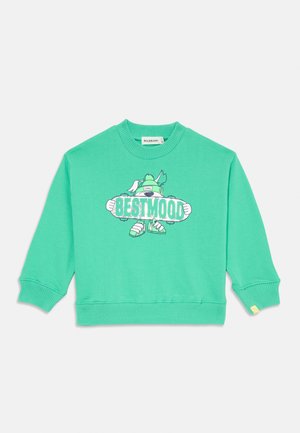 Πράσινη βαμβακερή μπλούζα με σχέδιο καρτούν που αναγράφει "BESTMOOD," ρυφωτά μανίκια και κίτρινη λεπτομέρεια στο στρίφωμα.