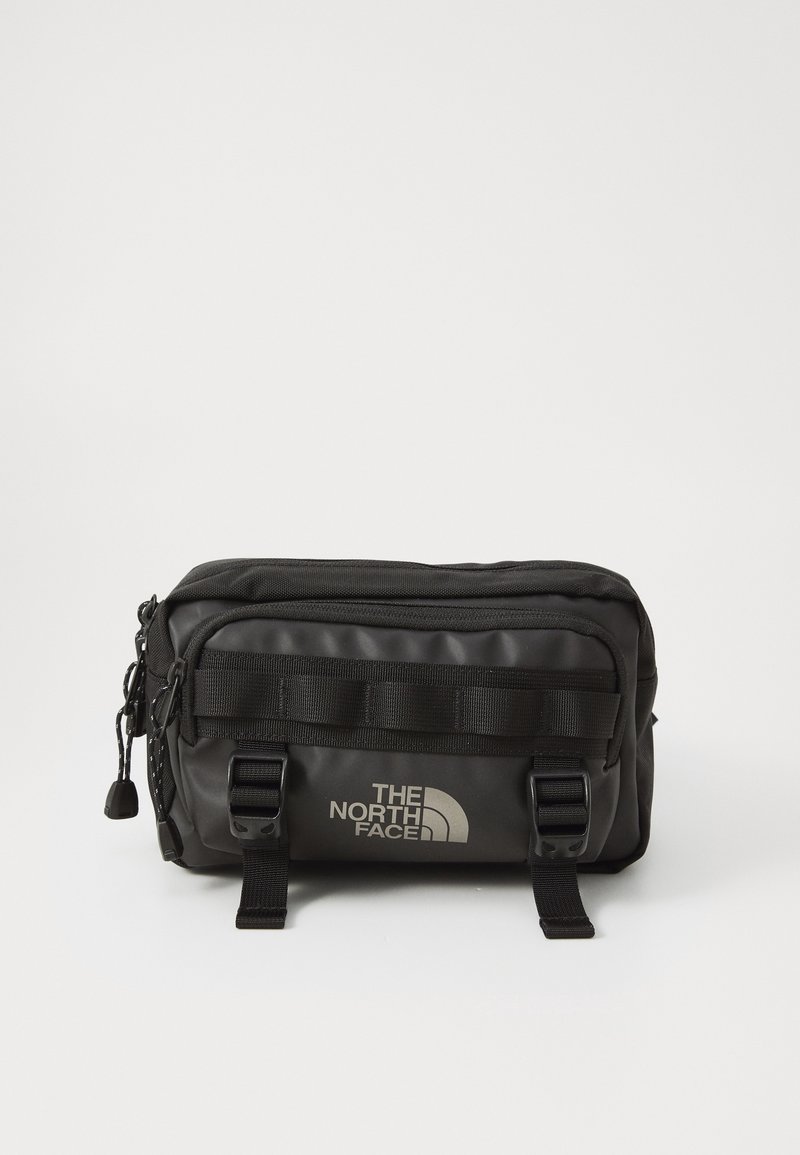Sac banane noir compact The North Face avec plusieurs compartiments zippés et sangles réglables avec boucle à l'avant.