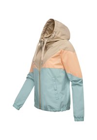 Färgblockerad zip-jacka med en beige huva, persikofärgade övre paneler och ljusblå nederdelar, med elastiska ärmslut och sidofickor.