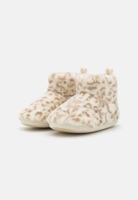 Fuzzy beige ankle boots with a leopard print pattern, soft surface texture, rounded toe, and small pull tabs at the back.