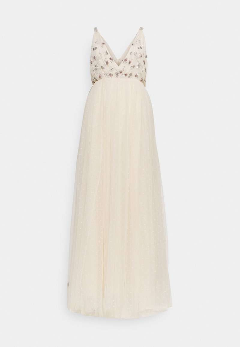 Robe longue crème sans manches avec décolleté en V, corsage orné de fleurs et jupe fluide en tissu transparent à motifs subtils de pois.