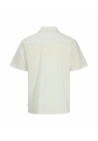 Camicia a maniche corte realizzata in tessuto leggero e perforato, con un motivo a rombi; colore crema con colletto classico e orlo dritto.