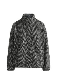 Czarny i biały polarowy sweter w wzór rybiej ości z wysokim kołnierzem i długimi rękawami. Miękka tekstura, luźny krój i brak widocznych zapięć.