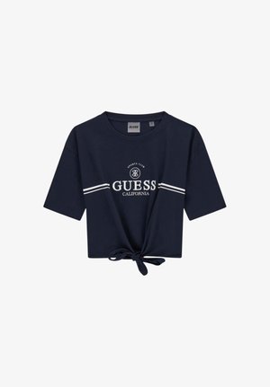 Marineblauw cropped T-shirt met korte mouwen, witte tekst "GUESS CALIFORNIA" en strepen, geknoopte knoop aan de voorzoom.