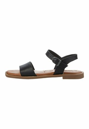 Black leather sandals with a wide strap across the toes and an adjustable ankle strap. Flat rubber sole and tan footbed.