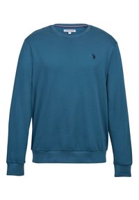 Tyrkysově modrá mikina s dlouhými rukávy, kulatým výstřihem, žebrovanými manžetami a lemem. Na levé straně hrudi je malý tmavý logotyp. Hladká textura látky.