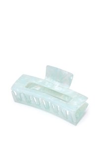 Transparent akryl hårklämma i ljus mintfärg, slät yta, avlång oval form och flera öppna spår för att säkert greppa håret.