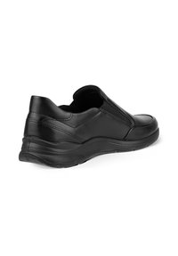 Sorte svarts lær slip-on sko med elastiske sidepaneler, avrundet tå, teksturert såle og glatt finish. Designet for komfort og enkel bruk.