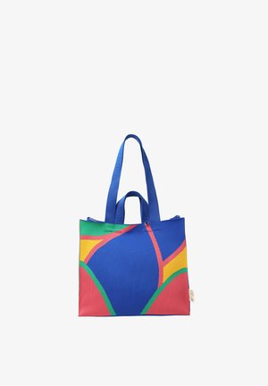 Válltáska kék fogantyúkkal, melyen absztrakt, kék, piros, sárga és zöld mintázat látható fehér háttéren.