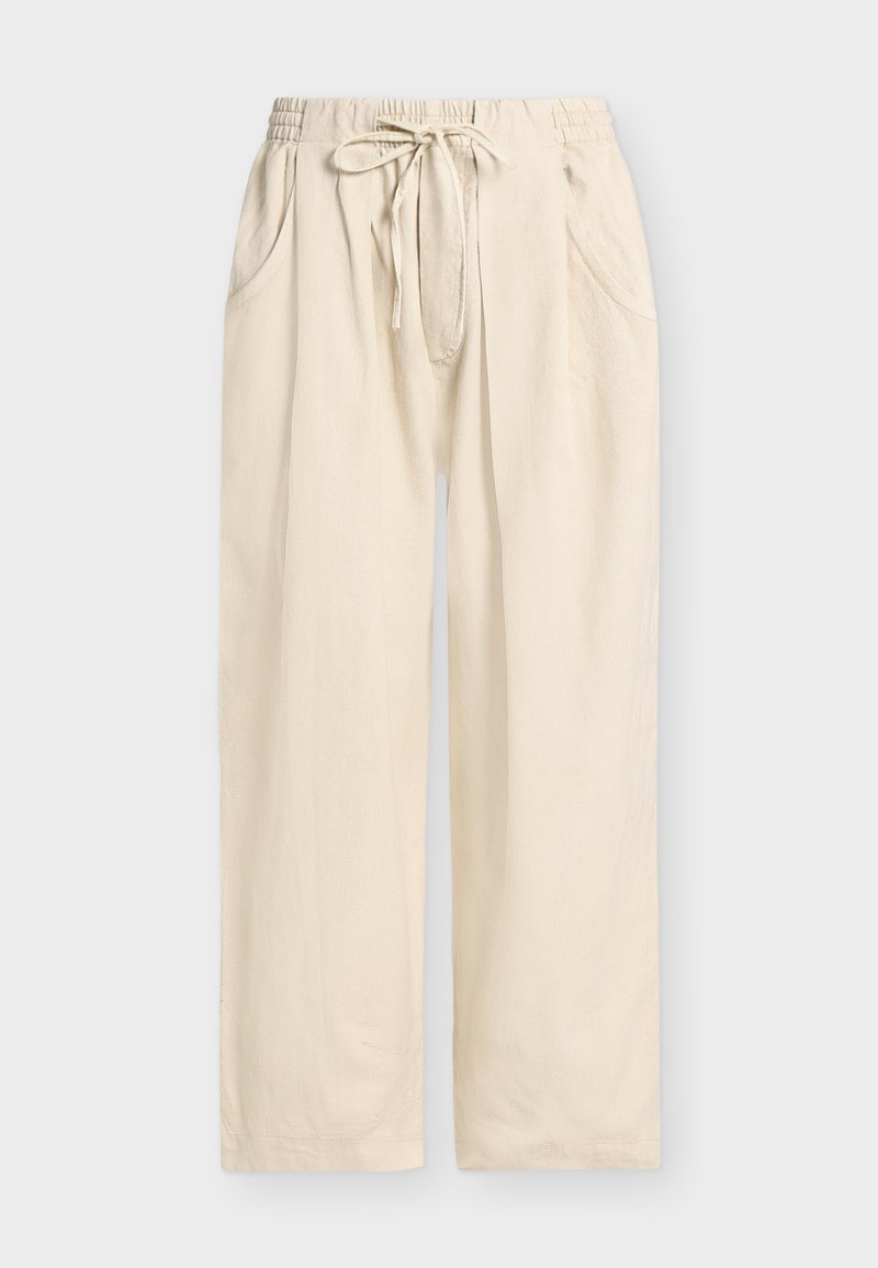 Μπεζ φαρδιά παντελόνια με ελαστική μέση, ρυθμιζόμενο κορδόνι και πλαϊνές τσέπες, παρουσιάζονται σε απλό φόντο.